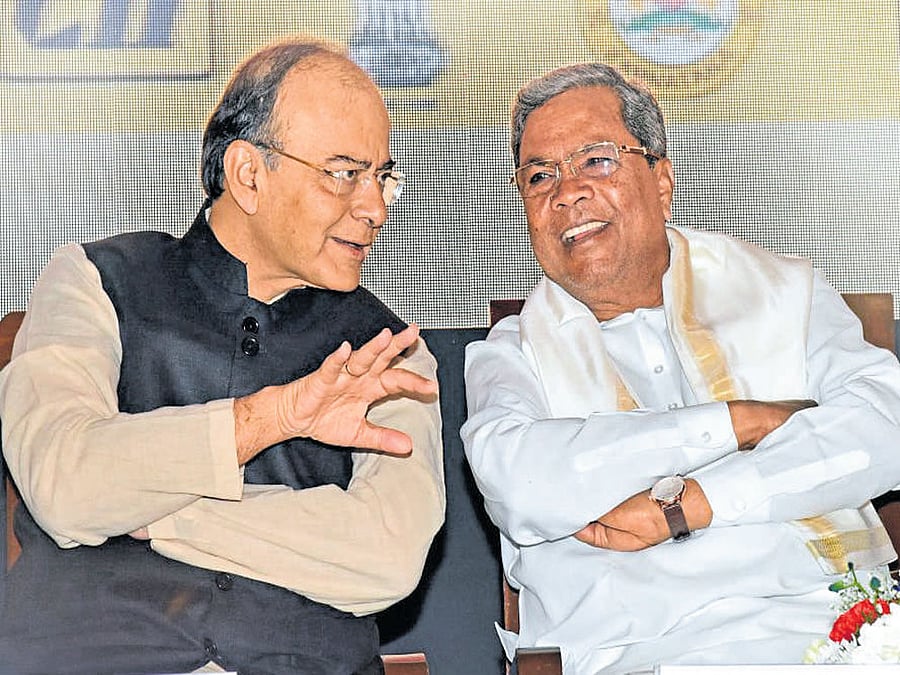 Finance Minister Arun Jaitley interacts with Karnataka            Chief Minister Siddaramaiah at the inaugural session of  Make in India- Karnataka Conference in Bengaluru on Monday. DH photo by S K Dinesh