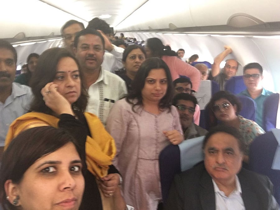 Passengers stranded in one of the planes at Kempegowda International airport on Wednesday.