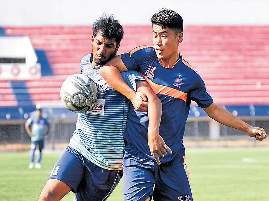INTENSE DUEL AGORC's Dada Nabeel (left) and ASC's Diwakar vie for the ball during their Super Division game. DH Photo