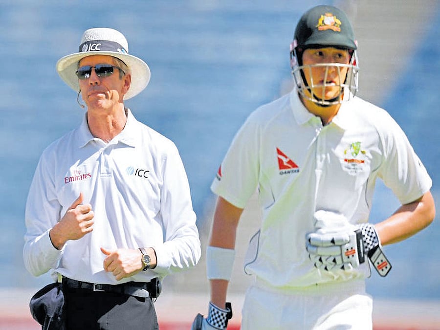 caught off guard Australia's Matt Renshaw holds his stomach while rushing back to the pavilion. afp
