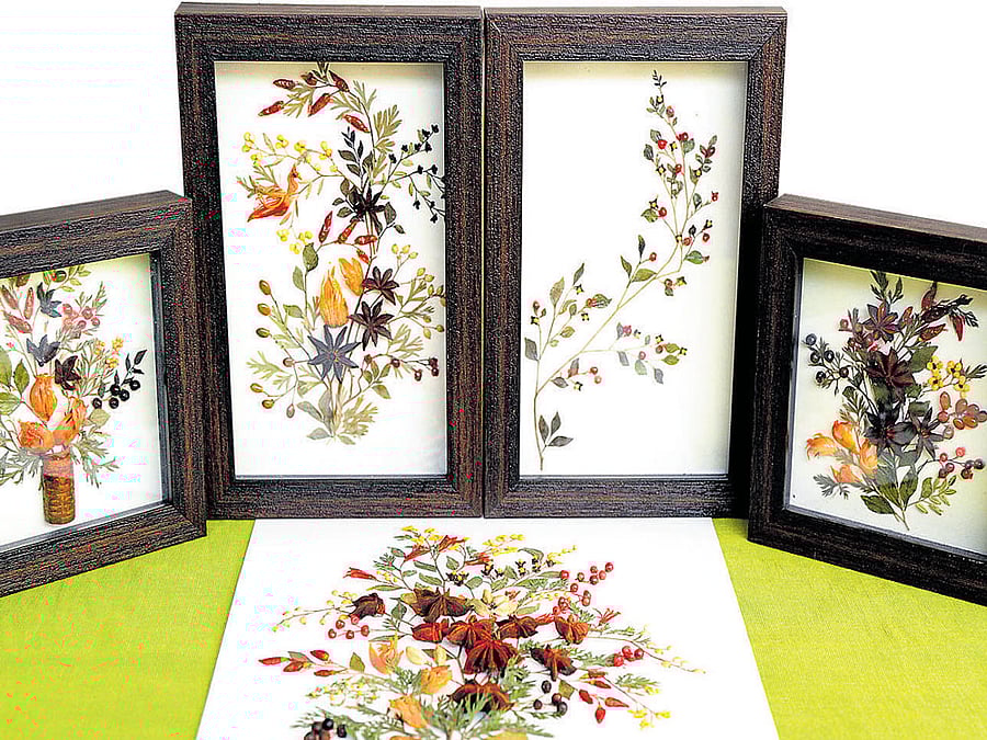 designs unlimited Creations made using spices like nutmeg, cinnamon, cloves etc and (below) works done with flat pebbles. DH PHOTO BY SRIKANTA SHARMA R