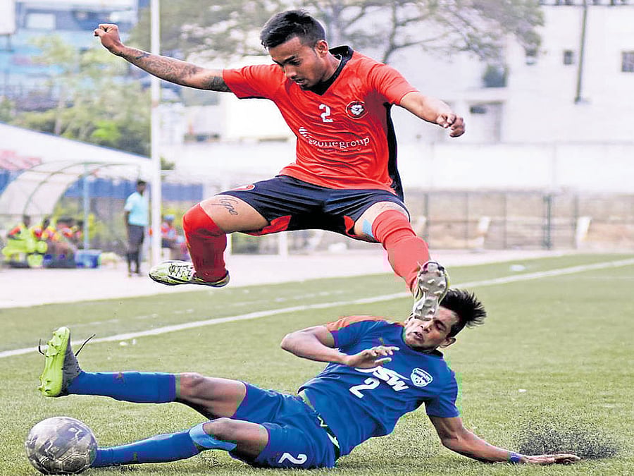 keen tussle Bengaluru FC's Prashanth K (below) tries to tackle Collin Abranches of Ozone FC&#8200;on Monday. DH Photo