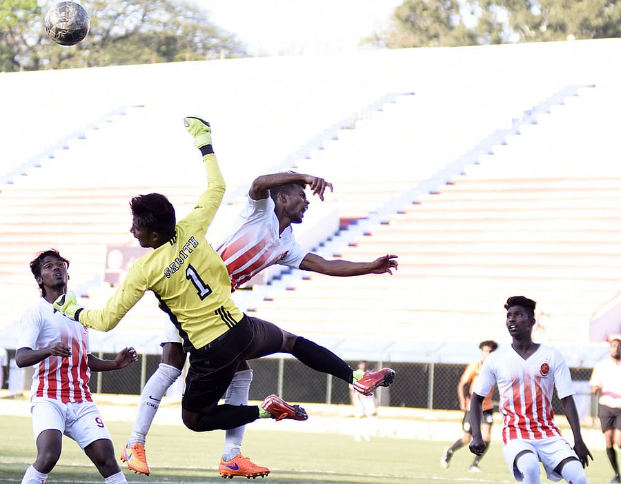 South United Fc Goalkeeper Srijith vie with CIL Fc Diwakar, during their clash in the Super Division Football league, at KSFA stadium in Bengaluru on Tuesday. DH Photo/ B H Shivakumar