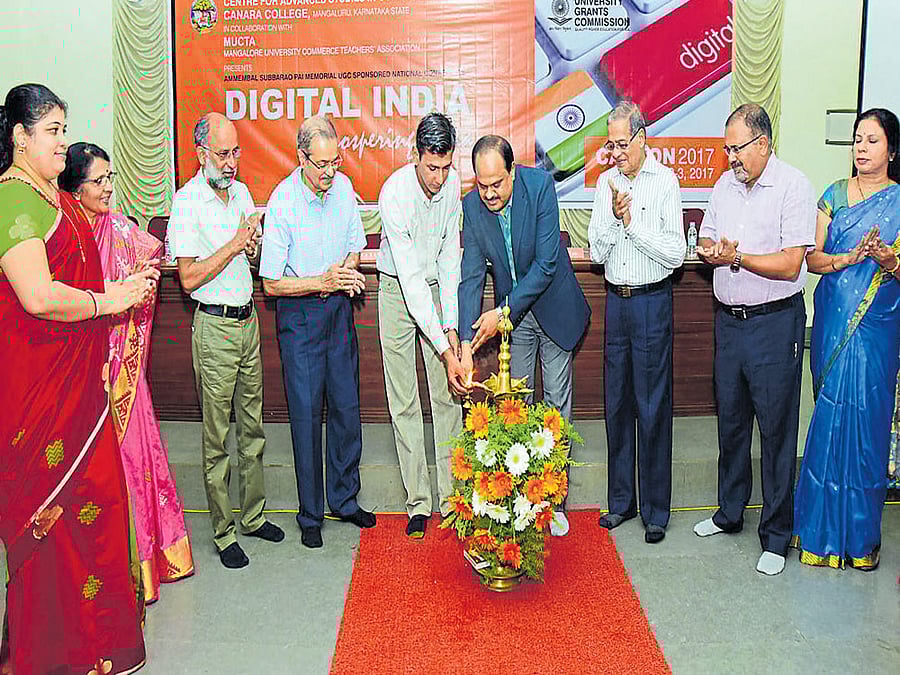 Zilla Panchayat CEO M R Ravi inaugurates a two-day national conference on Digital India at Canara College in Mangaluru on Thursday. DH photo