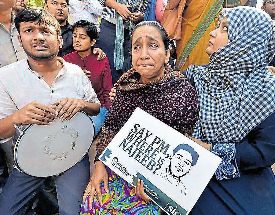 NO RELIEF FROM GRIEF: Missing JNU student Najeeb Ahmed's mother and sister participate in a protest march against the ABVP in New Delhi on Saturday. PTI
