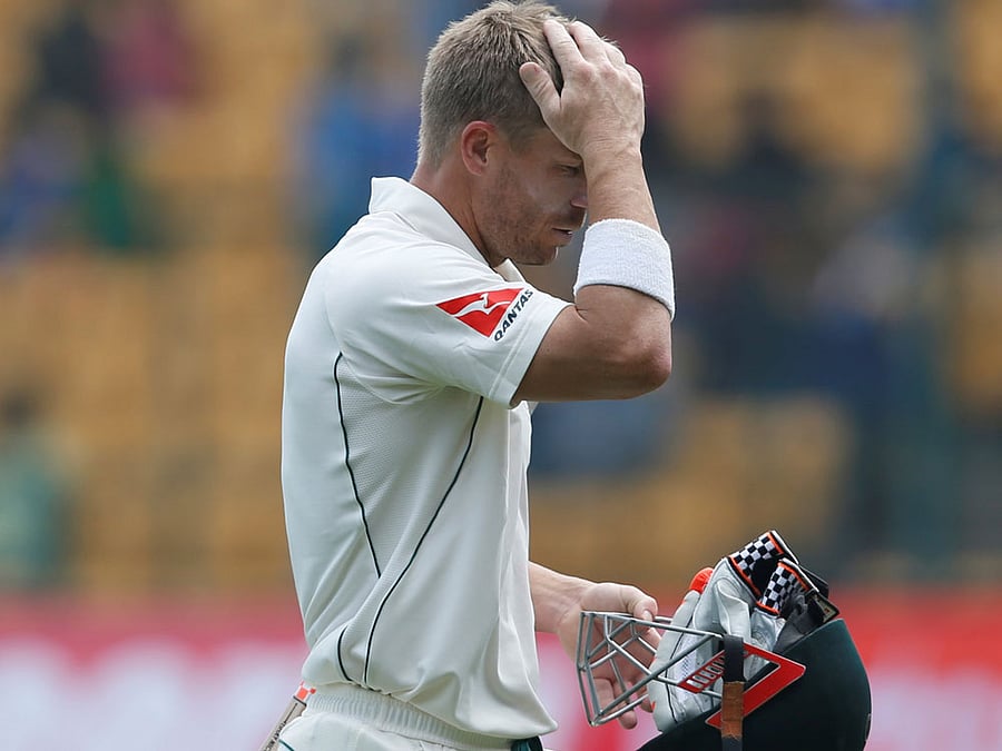Australia's David Warner walks off the ground after being dismissed. REUTERS