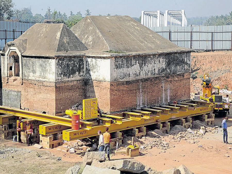 tough task Through a complex network of beams and jacks, an Indo-American team has lifted the armoury near Srirangapatna railway station by two feet.  DH photos by Srikanta Sharma R