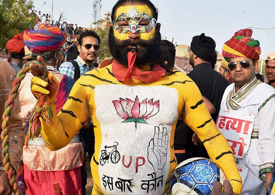People playing special Faganiya football match on the occasion of Holi festival in Bikaner on Friday. PTI Photo