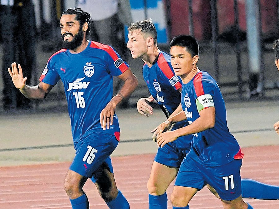 JOYOUS BUNCH: Bengaluru FC's Sandesh Jhingan (left) celebrates with John Johnson and Sunil Chhetri (right) after scoring against Mohun Bagan. DH PHOTO/KISHOR KUMAR BOLAR