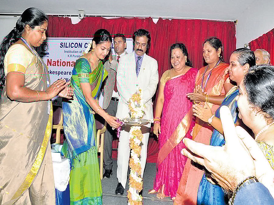 celebratory mode Staff members lighting the lamp.