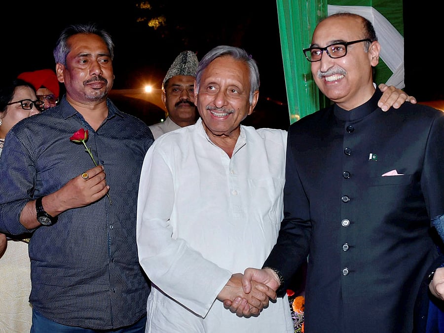 Pakistan High Commissioner Abdul Basit with Congress Leader Mani Shankar Aiyar during the Pakistan Day celebrations at Pak High Commission in New Delhi on Thursday. PTI Photo