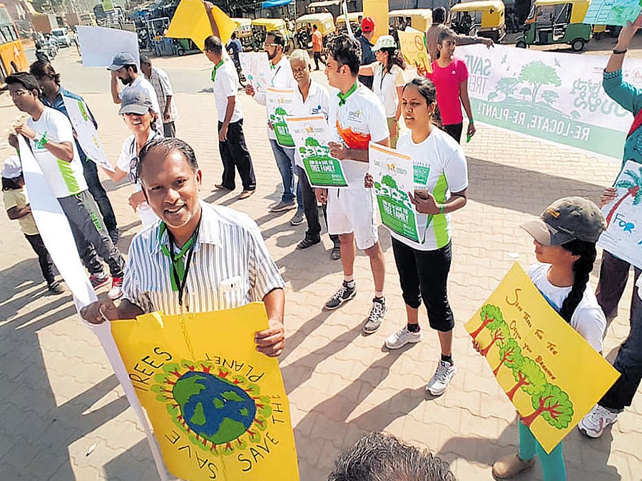 The participants at the awareness walk on Saturday demand that the state government stop cutting trees to widen roads in Sarjapur.