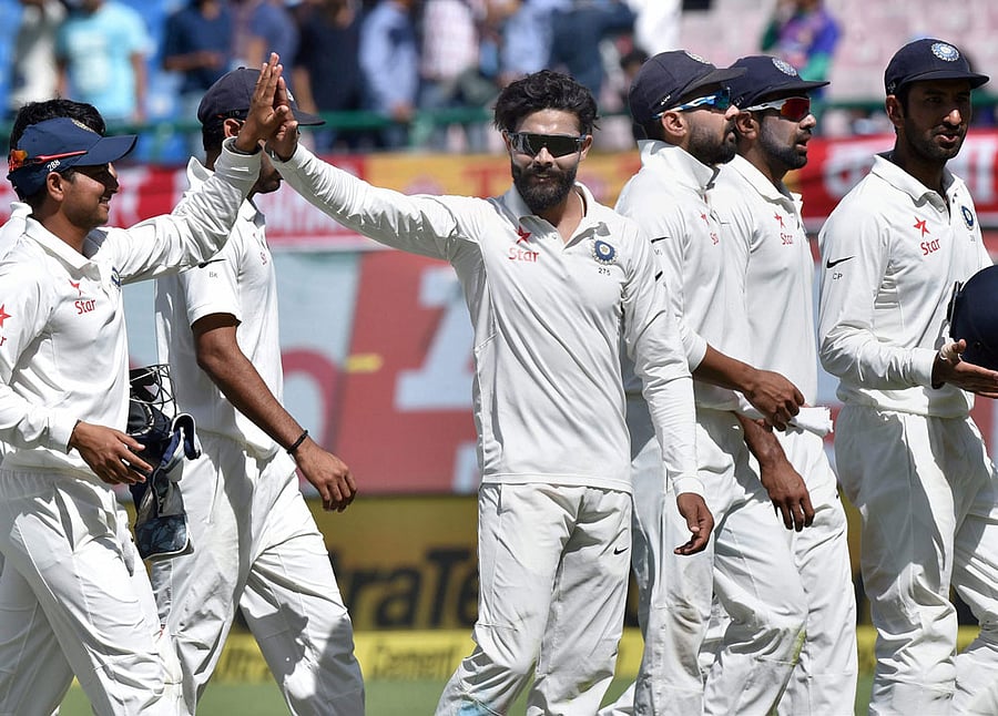 Crucial blow: Ravindra Jadeja (centre) celebrates after dismissing Shaun Marsh at Dharamsala. PTI