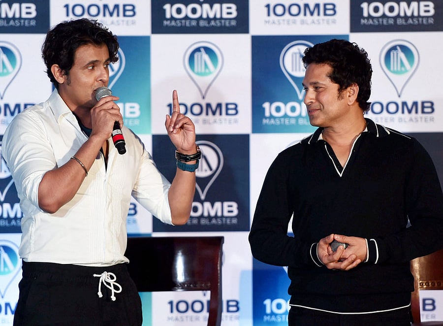 Indian crickter Sachin tendulkar and singer Sonu Nigam during the launch of new digital application'100MB' in Mumbai on Thursday. PTI Photo