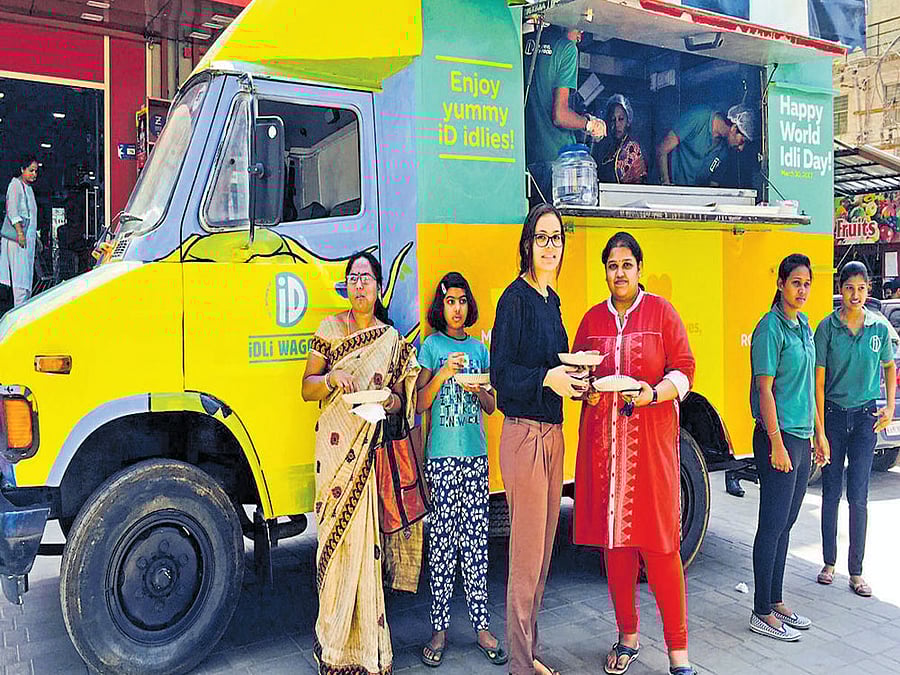 healthy experience Customers enjoying idlis.