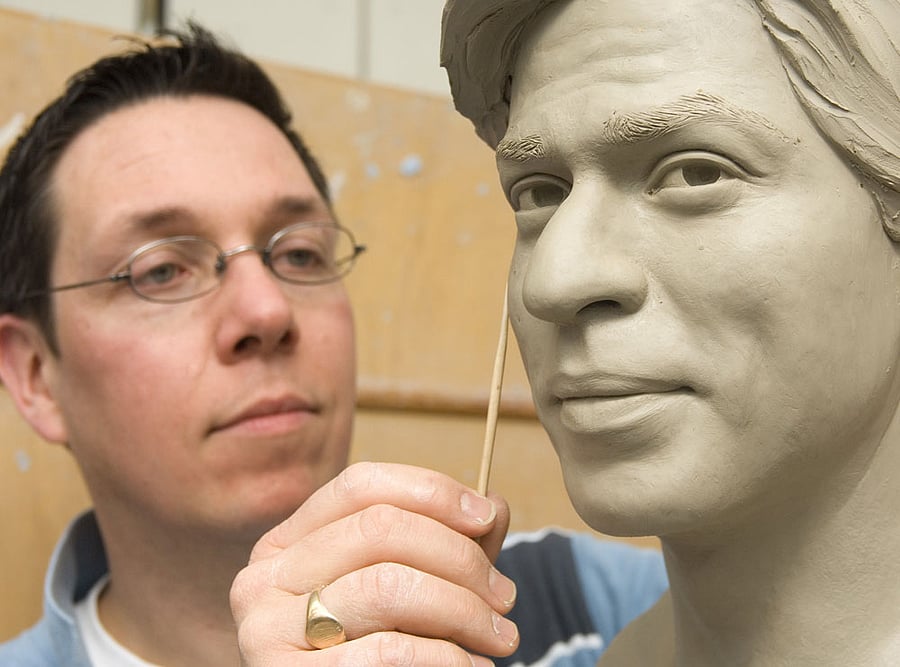 Captured in true form: Principal sculpture artist Stephen Mansfield working on Shahrukh Khan's wax statue.