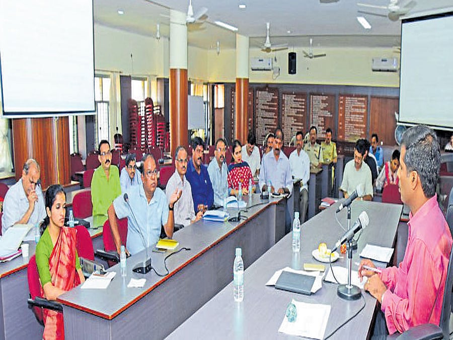 Additional Deputy Commissioner Kumar chairs a meeting converned to discuss the preparations for Indian Open of Surfing at DC's office in Mangaluru on Monday. DH photo