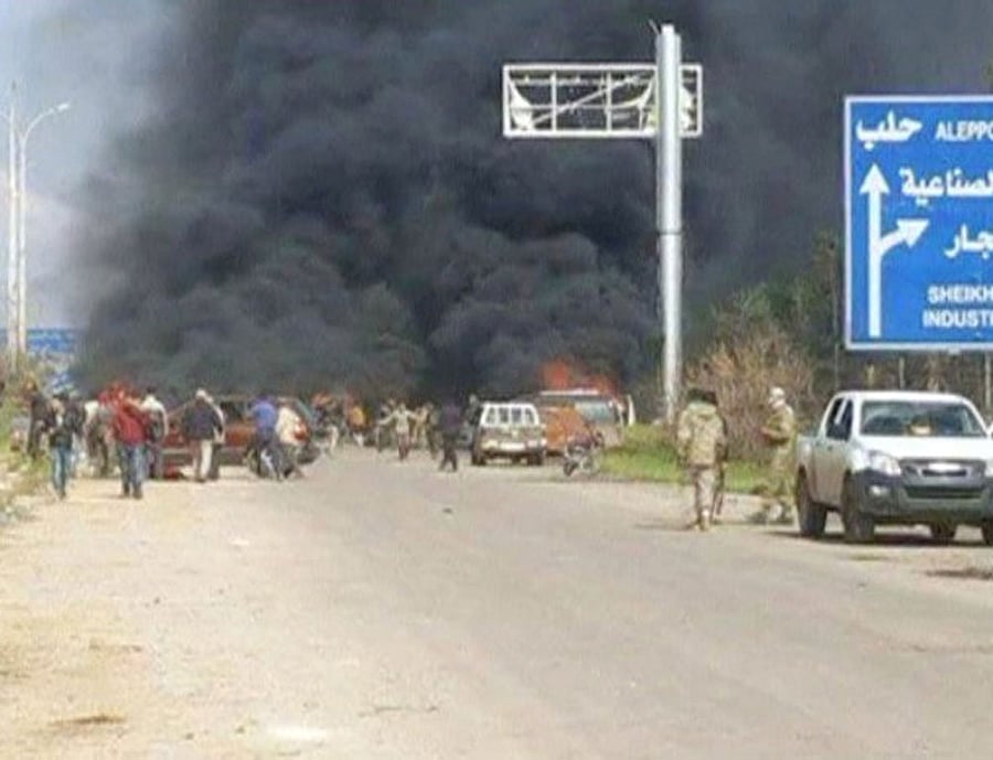 Still image shows a cloud of black smoke rising from vehicles in the distance in what is said to be Aleppo's outskirts, Syria April 15, 2017. Social Media Website via Reuters