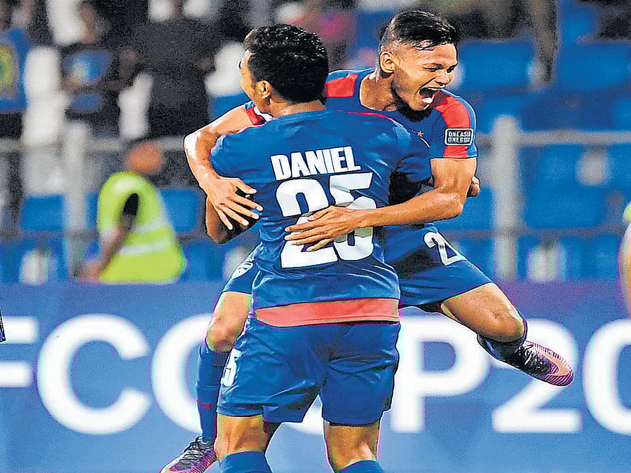 first strike: Bengaluru FC's Nishu Kumar celebrates with Daniel Lalhlimpuia after scoring against Abahani Dhaka on Tuesday. dh photo/ kishor kumar bolar