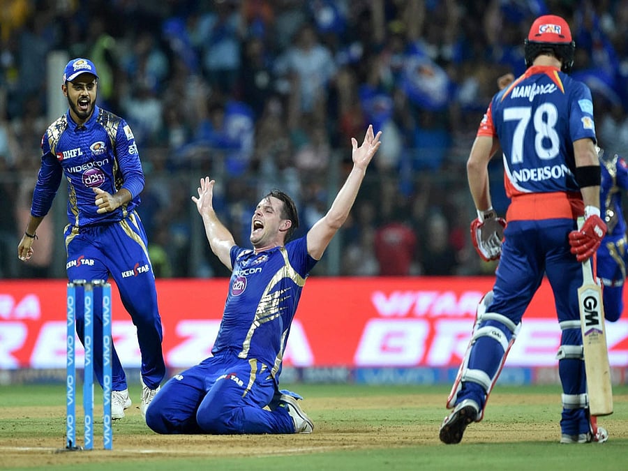 Mumbai Indians's player Mitchell McClenaghan celebrates the dismissal of Anderson during the IPL match against Delhi Daredevils in Mumbai on Saturday. PTI Photo