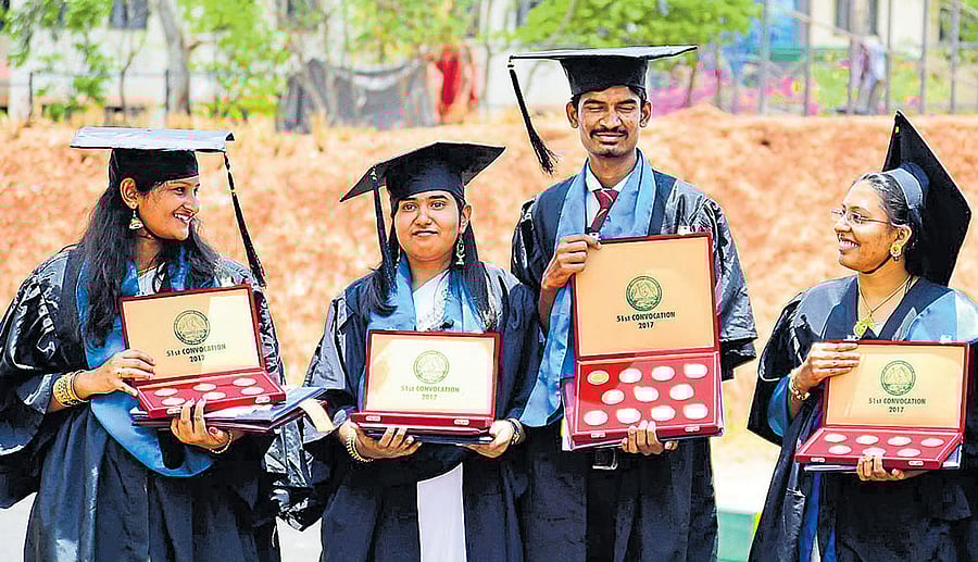Gold medalists Archana, Preethi C, Raghuveer M and Arathi pose with medals during the 51st Convocation of University of Agricultural Sciences in Bengaluru on Monday. dh photo