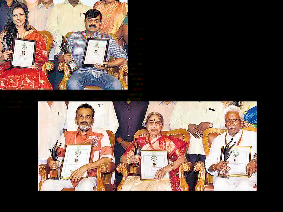 Chief Minister Siddaramaiah (not in picture) presented state film awards (2016) to Sruthi Hariharan (Best Actress) and Achyuth Kumar (Best Actor), lifetime achievement awards to K V Raju (Puttanna Kanagal Award), Advani Lakshmi Devi (Dr Rajkumar Award) and K Chinnappa (Dr Vishnuvardhan Award) in Bengaluru on Monday. DH photo