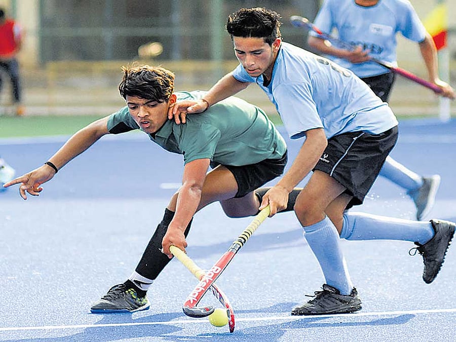 Keen tussle Abhishek (right) of Hockey Himachal and Aniket Dharmali of Vidarbha Hockey vie for the ball at the Field Marshal KM Cariappa Stadium on Thursday. dh photo