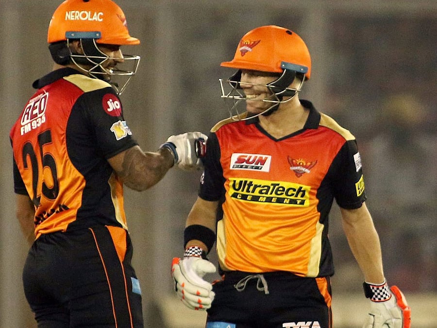 Sunrisers Hyderabad captain David Warner with teammate Shikhar Dhwan duringan IPL match against Kings XI Punjab in Mohali, on Friday. PTI Photo