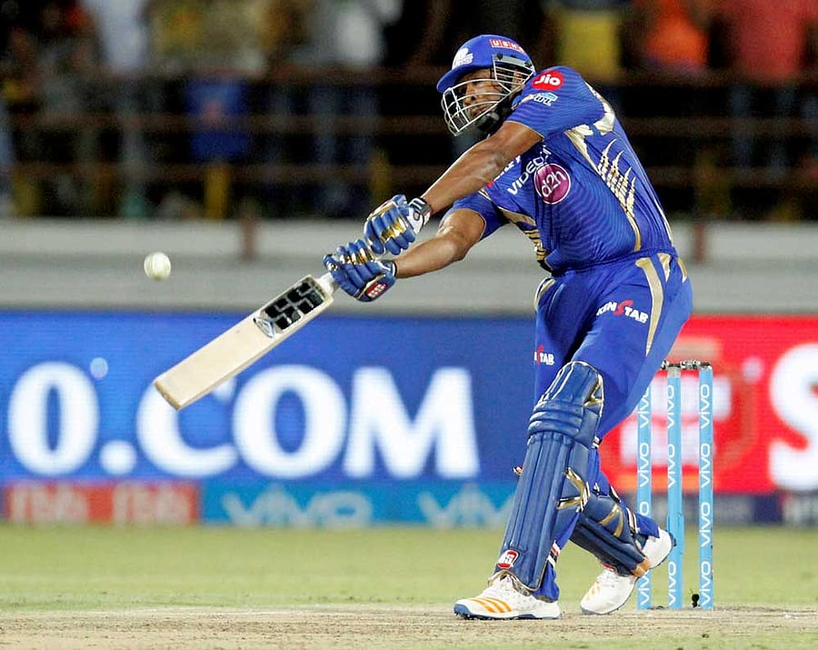 Mumbai Indians batsman Kiaron Pollard play shot during the IPL T 20 match against Gujarat Lions in Rajkot on Saturday. PTI Photo