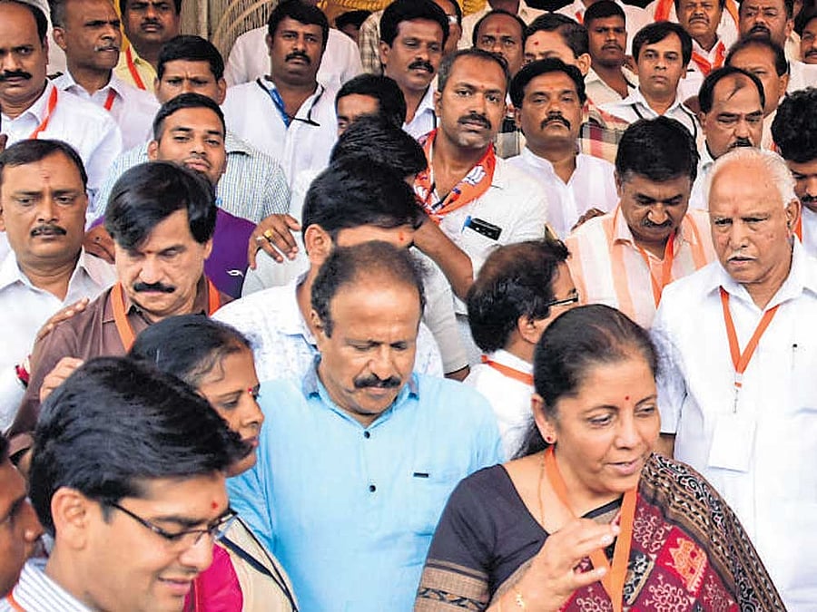 Union Minister Nirmala Sitharaman, MP Shobha Karandlaje, state BJP president B S  Yeddyurappa and other leaders come out of the Rajendra Kalamandira after the valedictory of the BJP state executive committee meting in Mysuru on Sunday. dh Photo