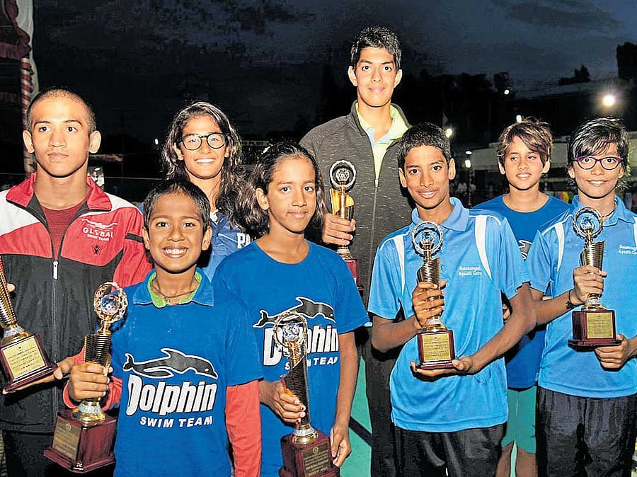 Champions: Individual winners in the State Junior and Sub-junior Aquatics Championship on Friday: From left (back row): Prasidh P Krishna (boys, Group II), Ridhi Bora (girls Group I), Srihari Nataraj (boys Group I), Suvana C Baskar (girls Group II). Front row: Krish Sukumar (boys Group IV), Nina Venkatesh (girls Group III), Adith Smaran Olety (boys Group III), Ridhima Veerendra Kumar (girls Group IV). DH PHOTO