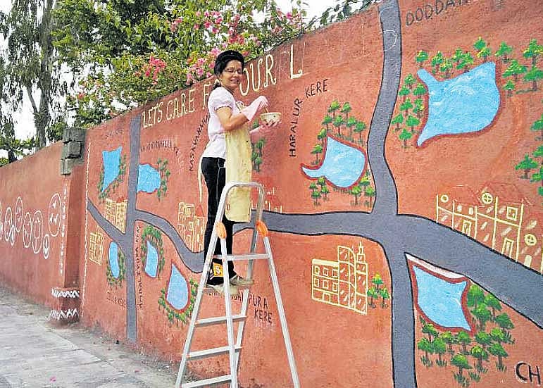 Residents of Springfield Apartments removed muck from  the walls, plastered them afresh, created a lawn and planted saplings to give a facelift to Haralur near Sarjapur.
