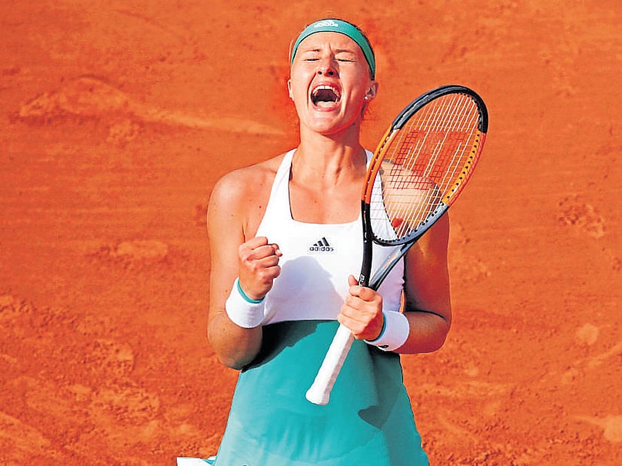 jubilant: France's Kristina Mladenovic exults after beating Spain's Garbine Muguruza in Paris on Sunday. Reuters