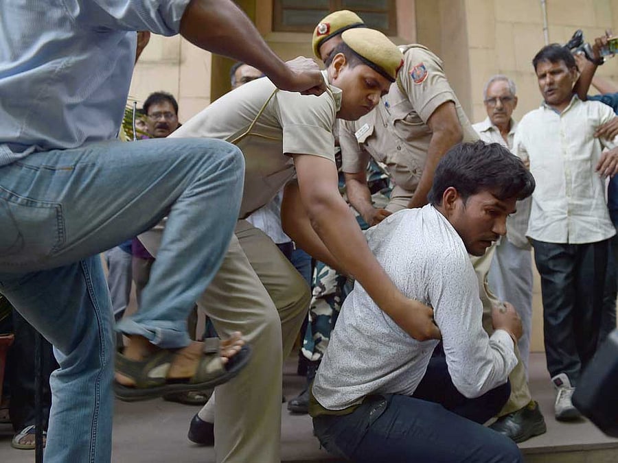 The party workers caught them and handed over to the police.