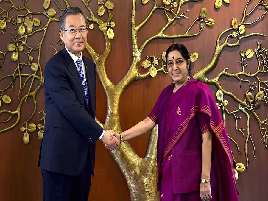 External Affairs Minister Sushma Swaraj shakes hands with Dongchea Chung, Special envoy of newly elected South Korean President Moon Jae-In, at a meeting in New Delhi on Friday. PTI Photo