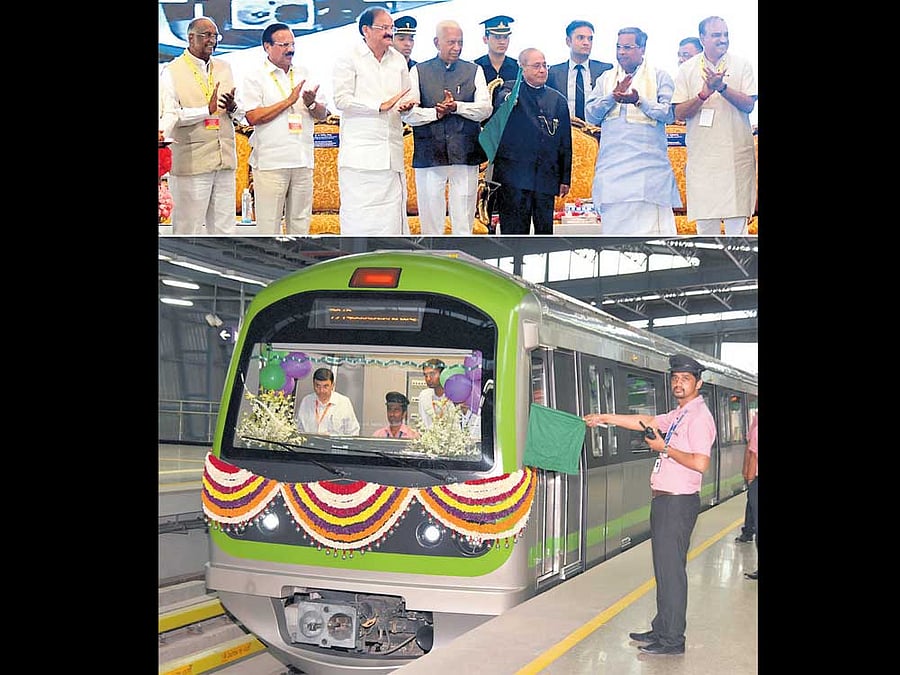 President Pranab Mukherjee flags off the Green Line of the Metro at the Vidhana Soudha on Saturday. Also seen are Legislative Council Chairman D H Shankaramurthy, Union ministers D V Sadananda Gowda, M Venkaiah Naidu, Governor Vajubhai Vala, Chief Minister Siddaramaiah and Union Minister H N Ananth Kumar. DH Photo