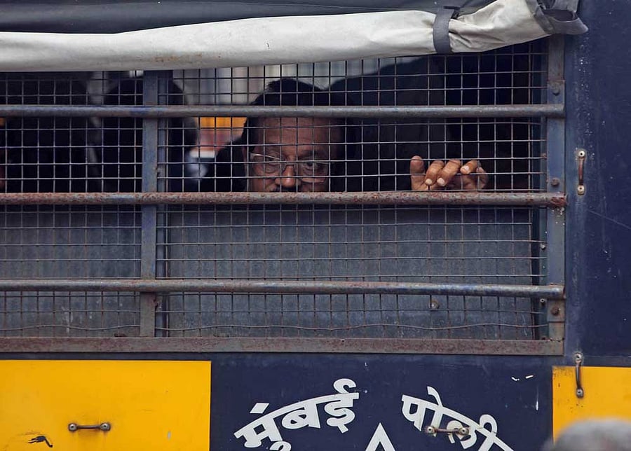 Convict Mustafa Dossa being escorted out of the special TADA court. DH ​File ​Photo