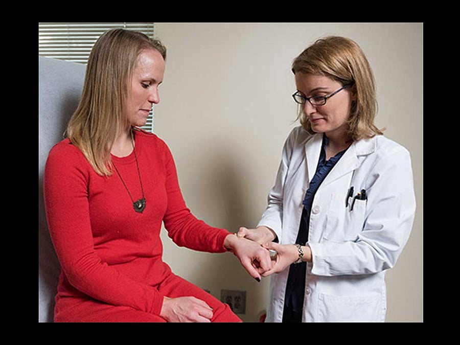 Small skin patches with dissolvable microneedles were safe and well-tolerated, generated robust immunity against influenza, could be self-administered by study participants and were strongly preferred over shots. Dr. Nadine Rouphael applies the patch to study volunteer Daisy Bourassa. Photo credit: Woodruff Health Sciences Center/EMORY news center