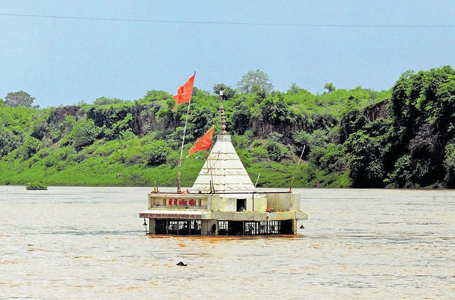 Nature's wrath: A temple submerged in the flood waters of the Narmada at Gwarighat in Jabalpur on Friday. AFP
