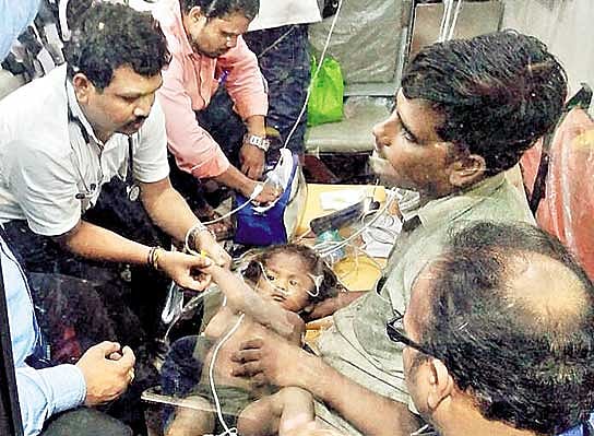 Little Chandrasekhar in Ambulance after he was rescued. DH photo