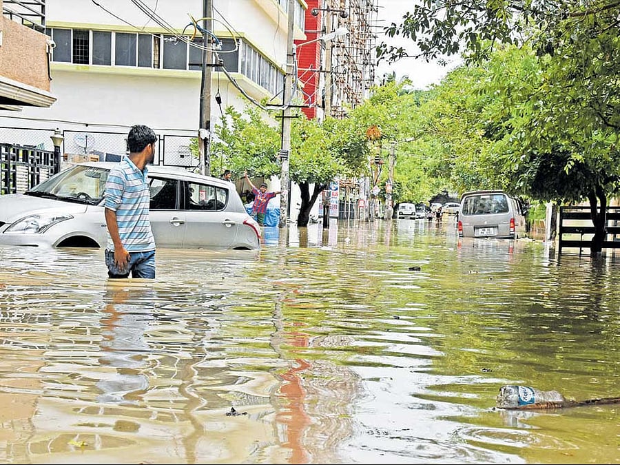 A flooded road at Ashwini Layout, Ejipura. DH PHOTO