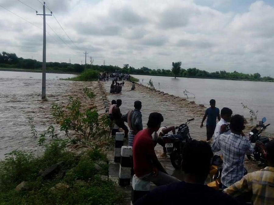Roads in the rehabilitation centre at Kudalasangama in Hungund taluk have been washed away in Friday night showers. DH Photo