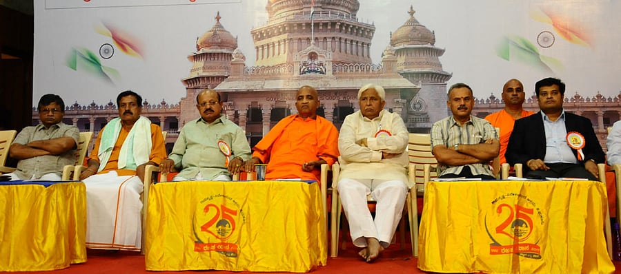Rural Development and Panchayat Raj Minister H K Patil, District Minister T B Jayachandra, Nirbhayananda Saraswati of Ramakrishna-Vivekanada Ashram, Gadag, legislators YSV Dutta, B Suresh Gowda, ex-MLC Siddaramanna and DC K P Mohan Raj are seen during a convention of elected representatives organised, as part of Rajatayana- Rajat Aadalitha, by Ramakrishna-Vivekananda Ashram in Tumakuru on Friday.
