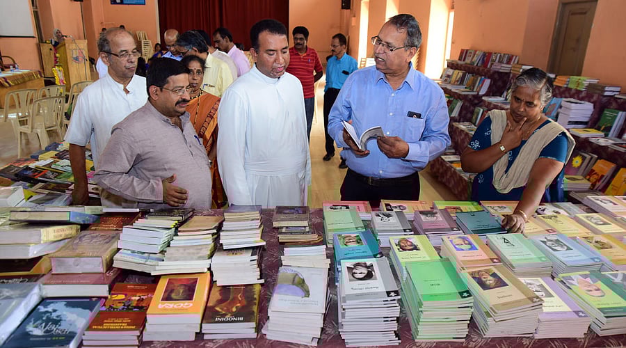 Litterateur and Hampi former Vice Chancellor Prof B A Vivek Rai, Sahitya Akademi Regional Secretary SP Mahalingeshwar, St Aloysius College Principal Fr Praveen Martis and Sahitya Akademi Southern Region Sales in-charge Jayanti during the book exhibition organised by Sahitya Akademi, on the occasion of National Book Week, at St Aloysius College in Mangaluru on Tuesday.