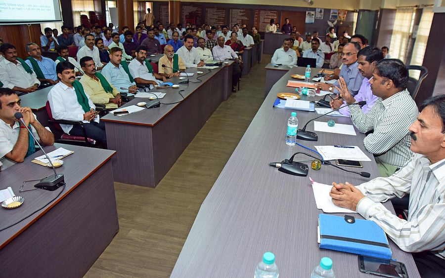 Deputy Commissioner Sasikanth Senthil speaks during a workshop on fFarmer Crop Survey Mobile App, at DC's office in Mangaluru on Thursday. Additional DC Kumar, Agriculture department Joint Director Kempegowda and Assistant Commissioner Renuka Prasad look on. DH Photo
