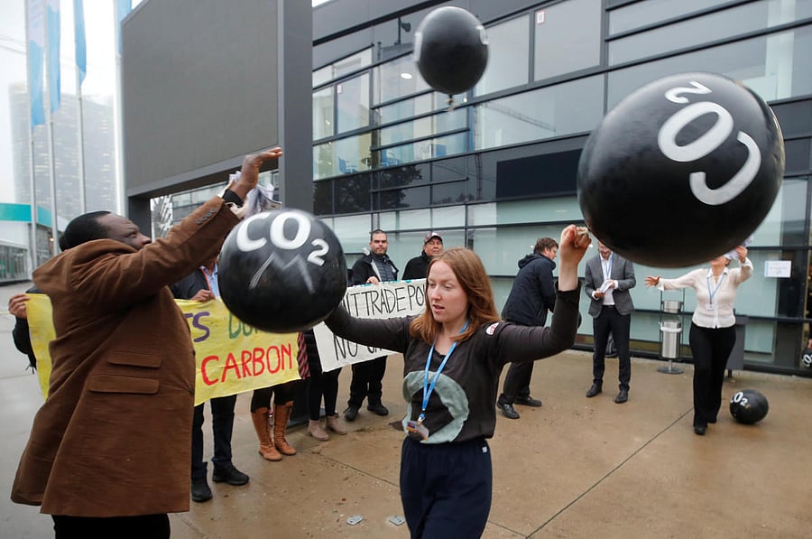 Activists protest against the carbon dioxide emissions trading in front of the World Congress Centre Bonn, the site of the COP23 U.N. Climate Change Conference, in Bonn, Germany, November 17, 2017. REUTERS