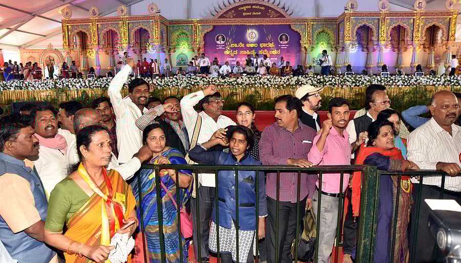 People stage a protest against Pejavara Sri during the 83rd Akhil Bharata Kannada Sahitya Sammelana organized at Maharaja College Grounds in Mysuru on Sunday. Photo by SAVITHA. BRProtest
