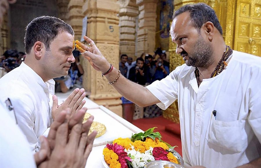 Congress vice-president Rahul Gandhi offering prayers at the Somnath Temple in Gujarat on Wednesday. PTI
