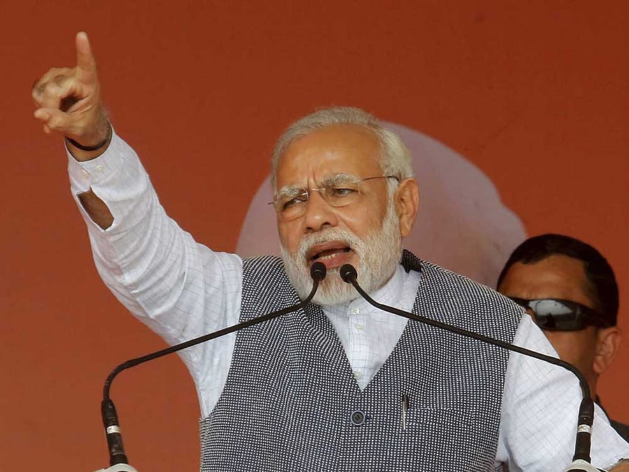 Prime Minister Narendra Modi addresses an election campaign rally in Sanand on Sunday. PTI Photo