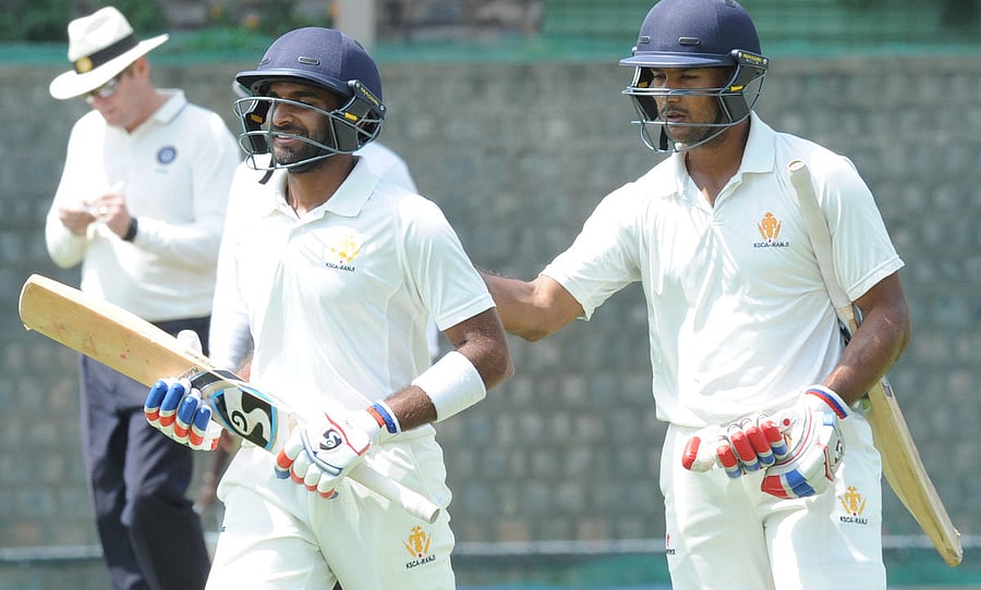 Karnataka's R Samarth (left) and Mayank Agarwal batting on unbeaten half century during the lunch time against Delhi in the Ranji cricket match at Aloor ground in Bengaluru on Thursday. Photo Srikanta Sharma R.